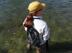 Fly fishing lanyard being worn and showing net attached.